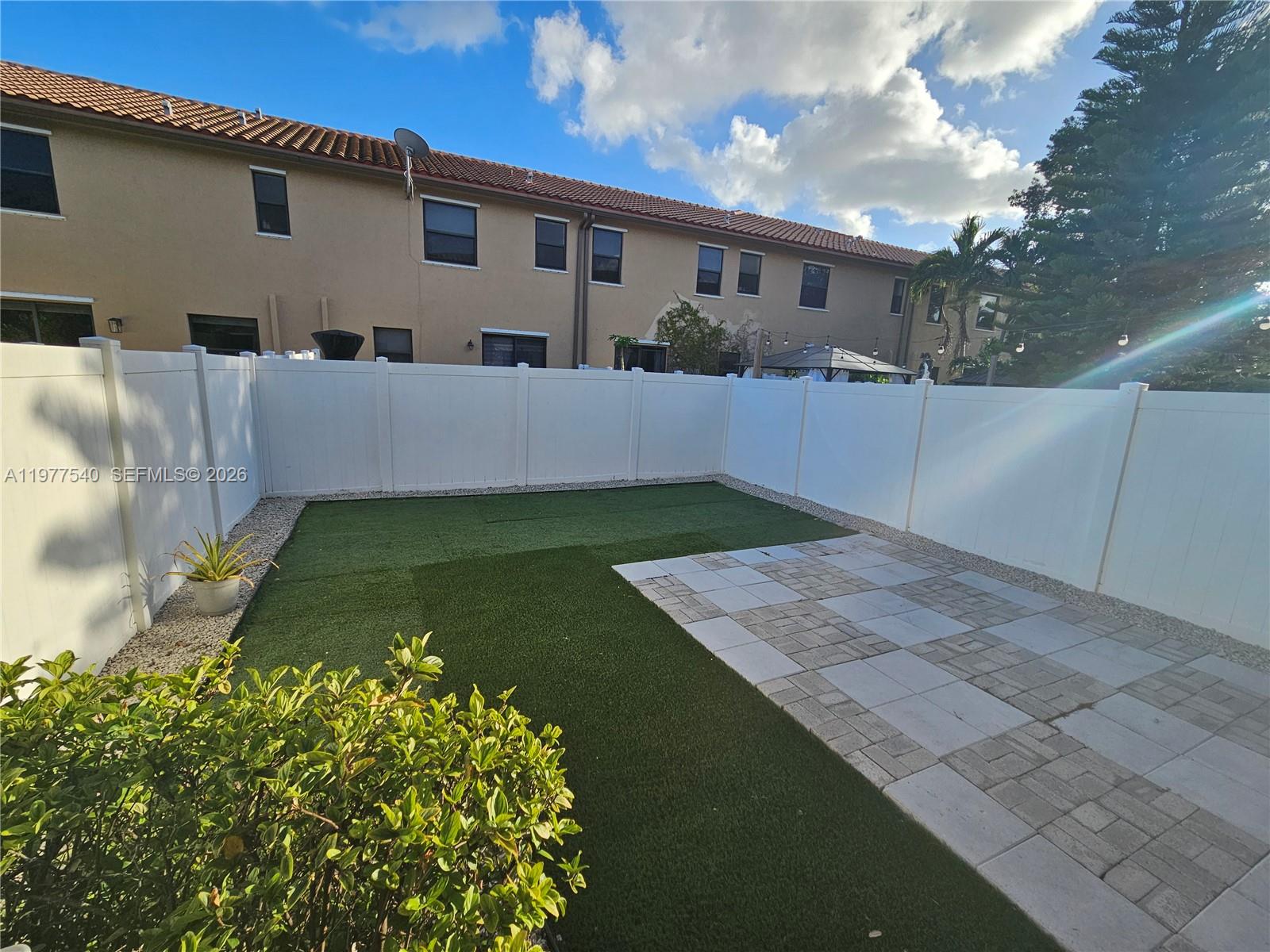 3370 West 90th Street, Unit A Hialeah, FL 33018 - Photo 9 of 40 a front view of a house with a yard