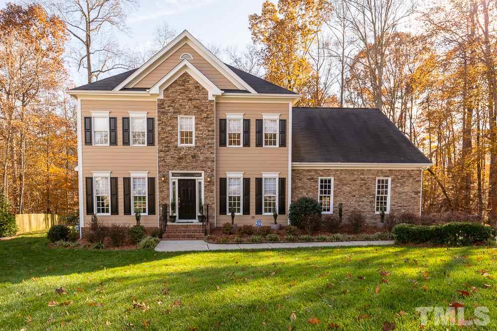 5001 Perception Lane Raleigh, NC 27613 - Photo 1 of 28 a front view of a house with a yard