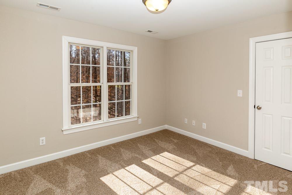 5001 Perception Lane Raleigh, NC 27613 - Photo 19 of 28 a view of an empty room with a window
