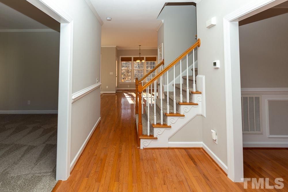 5001 Perception Lane Raleigh, NC 27613 - Photo 3 of 28 a view of entryway and hall with wooden floor