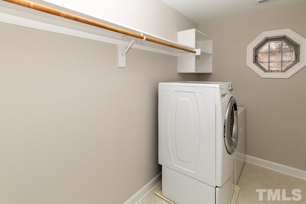5001 Perception Lane Raleigh, NC 27613 - Photo 22 of 28 a utility room with dryer and washer