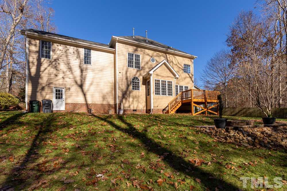 5001 Perception Lane Raleigh, NC 27613 - Photo 25 of 28 a view of a house with backyard and sitting area