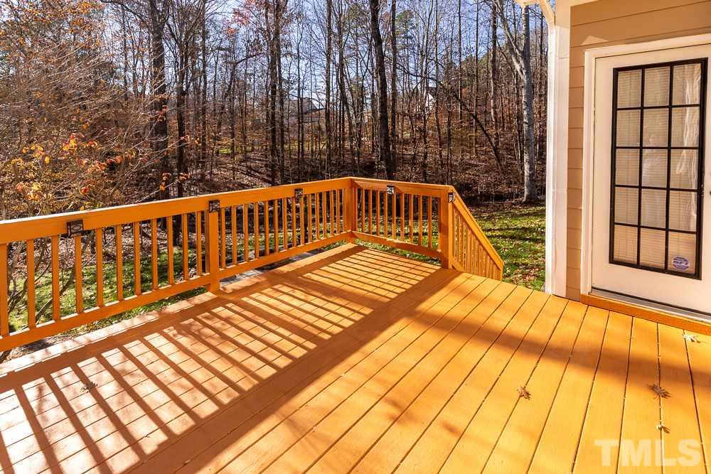 5001 Perception Lane Raleigh, NC 27613 - Photo 27 of 28 a view of balcony with wooden floor and fence