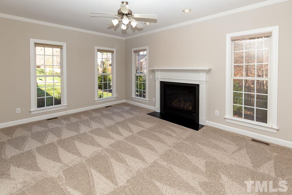 5001 Perception Lane Raleigh, NC 27613 - Photo 5 of 28 a view of an empty room with window and fireplace