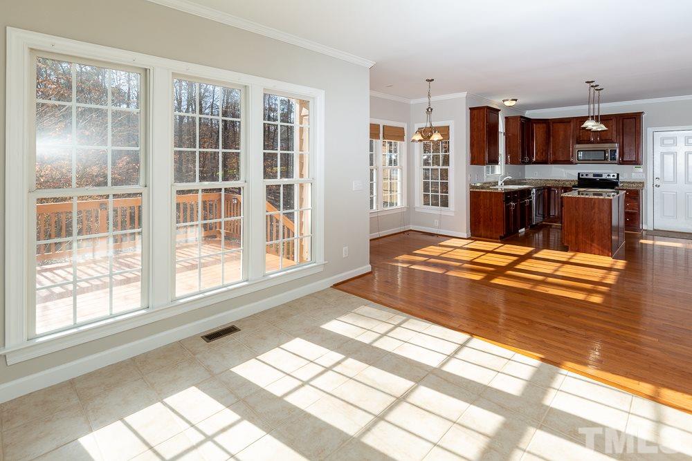 5001 Perception Lane Raleigh, NC 27613 - Photo 7 of 28 a living room with patio furniture and a large window