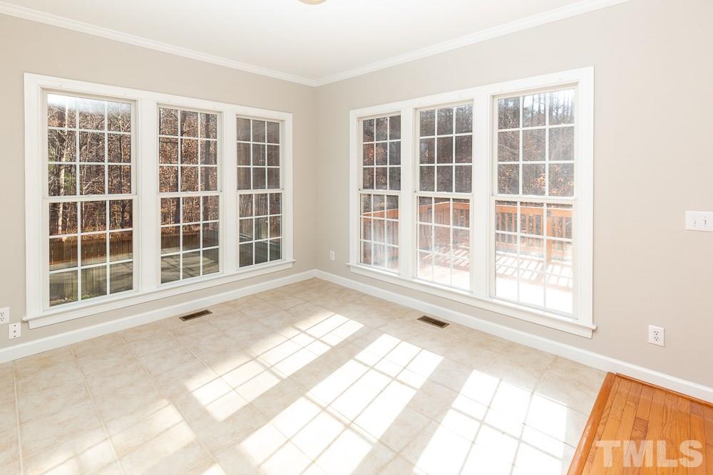 5001 Perception Lane Raleigh, NC 27613 - Photo 10 of 28 a view of an empty room with a large window