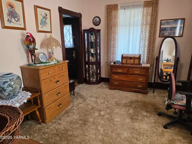 a bed room with a bed and a dresser