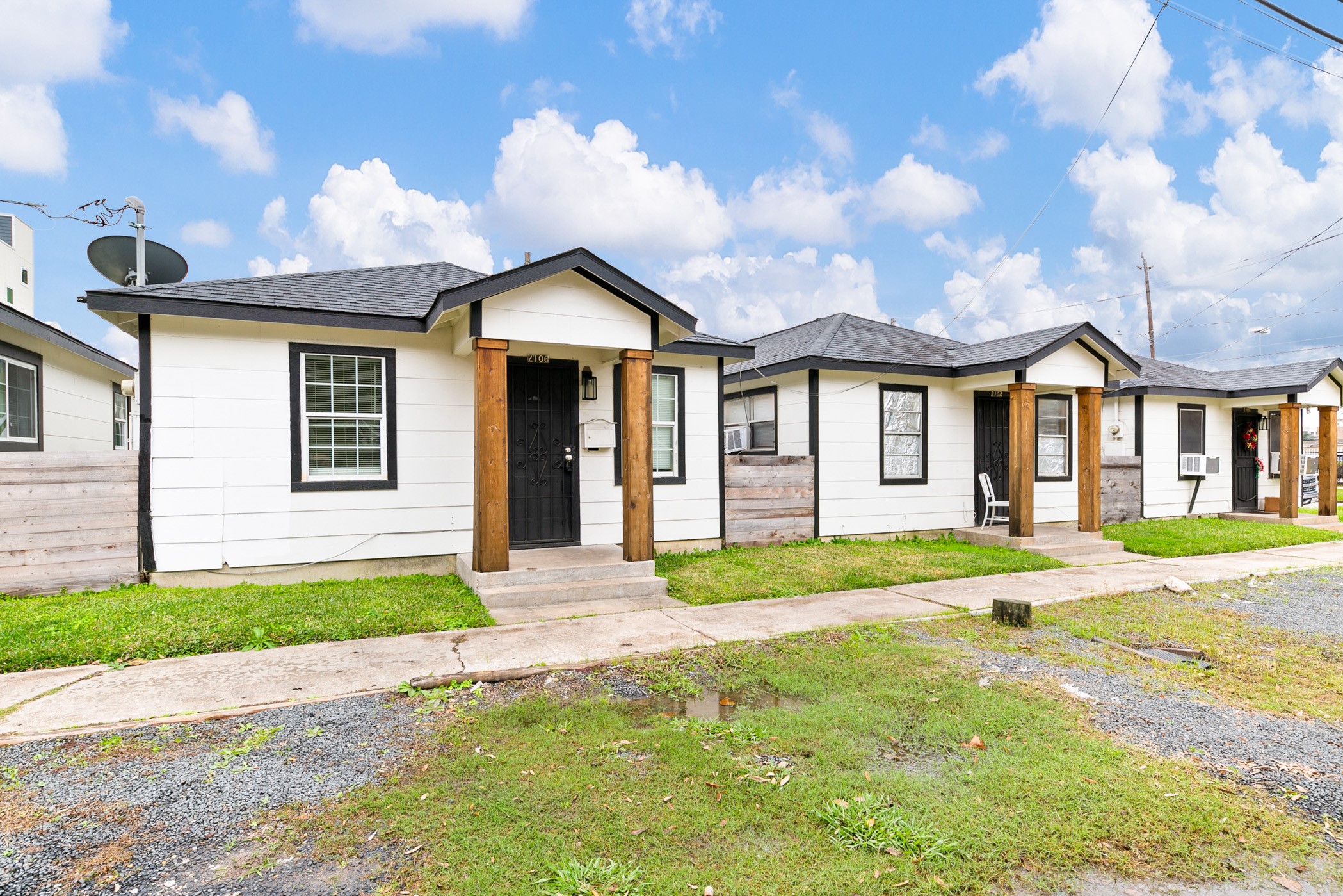 2106 Hadley Street, Unit 2106 Houston, TX 77004 - Photo 11 of 11 a front view of a house with a yard and garage