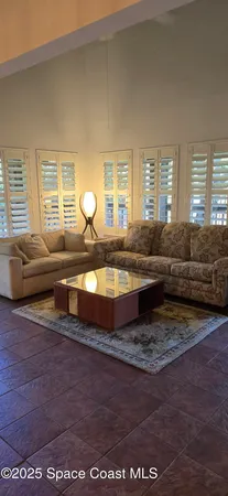 a view of a patio with table and chairs