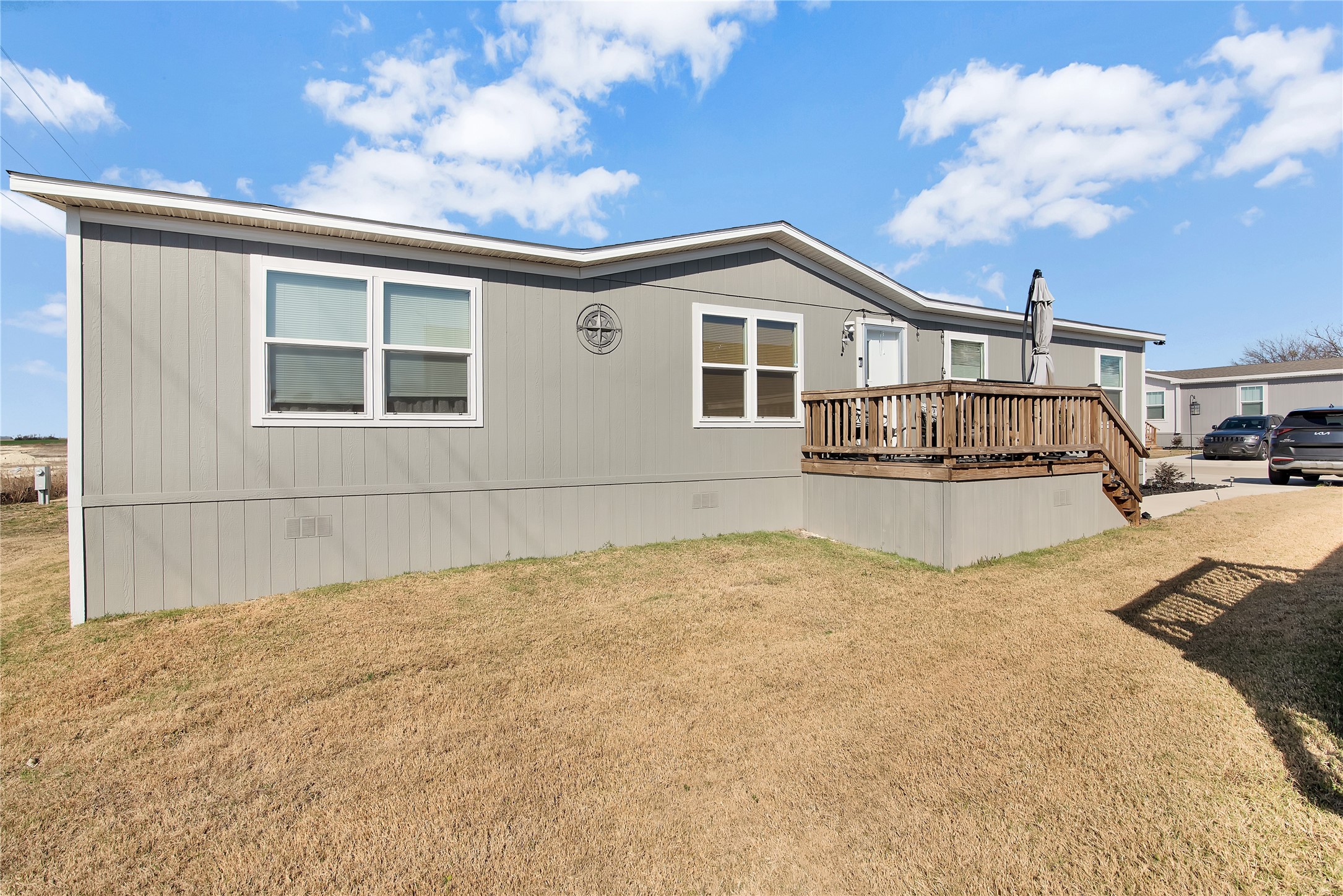 1007 Keswick Road Wilmer, TX 75172 - Photo 3 of 16 a front view of a house with a yard