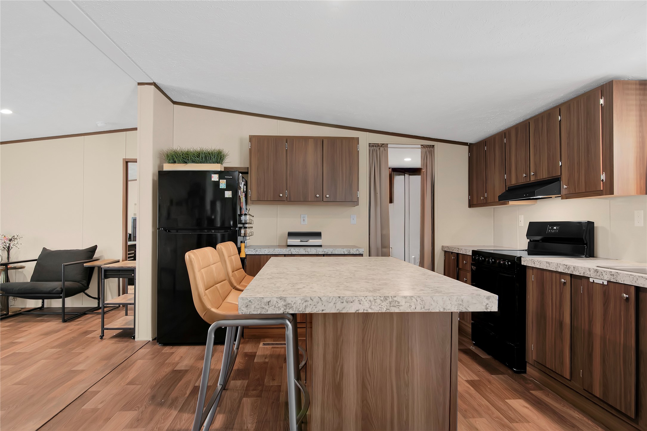 1007 Keswick Road Wilmer, TX 75172 - Photo 7 of 16 a kitchen with granite countertop a refrigerator stove top oven and sink