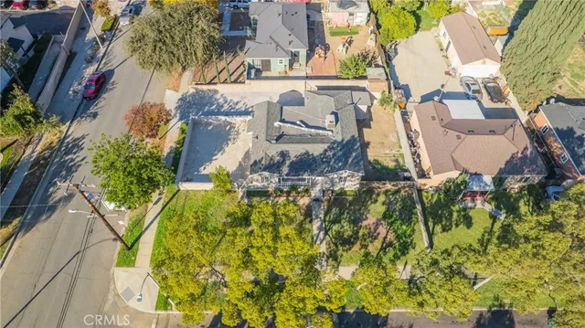 an aerial view of a house with swimming pool