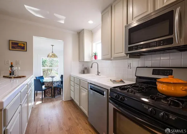 a kitchen with a stove and a microwave