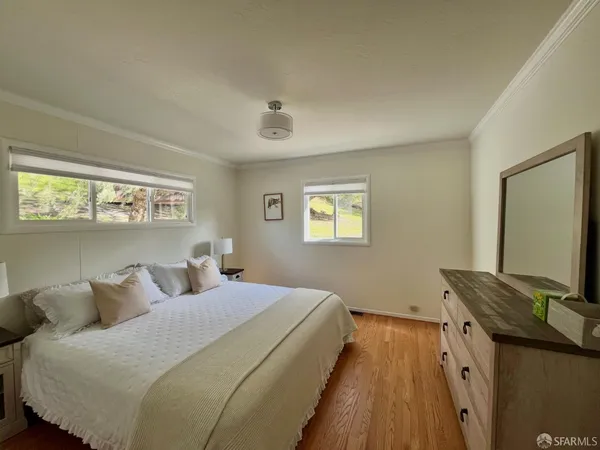 a bedroom with bed and window