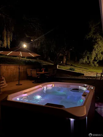 a view of a swimming pool with seating space