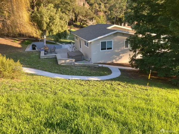 a front view of a house with a yard