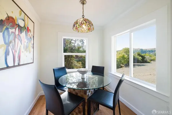 an aerial view of a house with a yard and potted plants