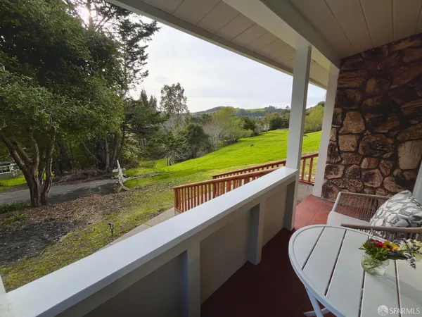 a view of roof deck with furniture