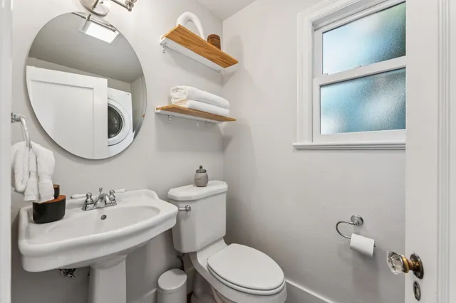 a bedroom with a bed and chair