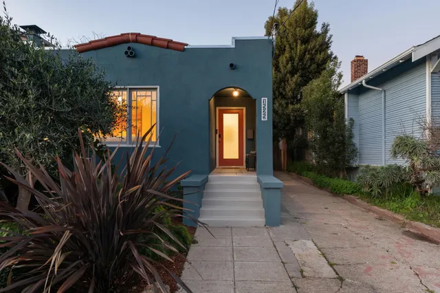 a view of a patio with table and chairs and potted plants