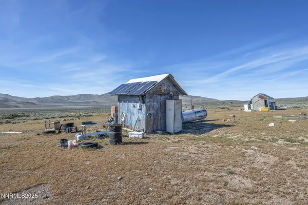 a view of a house with truck parked on the road
