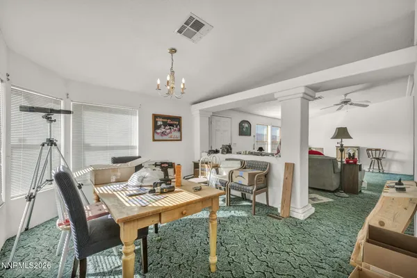 a view of a dining room with furniture