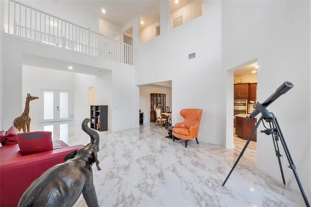 a kitchen with stainless steel appliances granite countertop sink a refrigerator and a stove