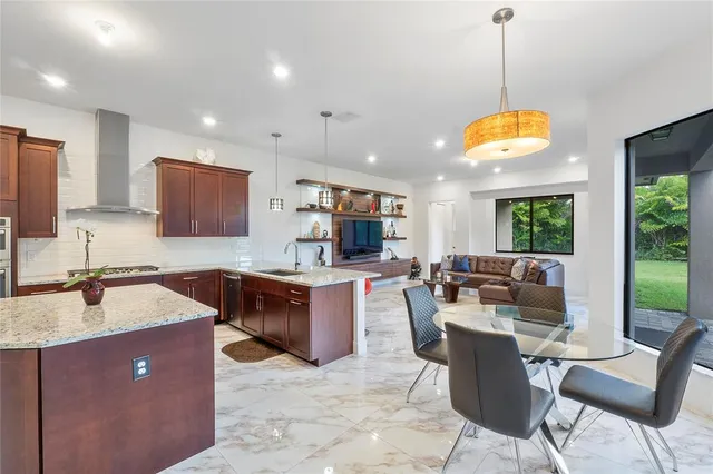 a bathroom with a tub a sink a mirror and a shower