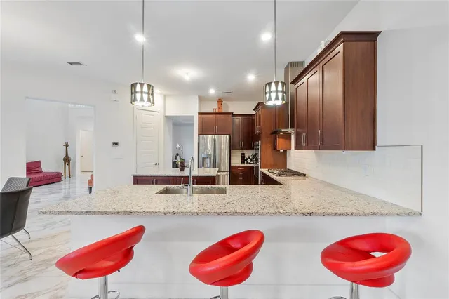 a bedroom with a large bed and a flat screen tv