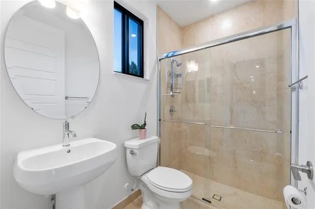 a bedroom with a bed and a tv on table