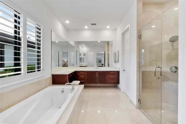 a bedroom with a bed and flat screen tv