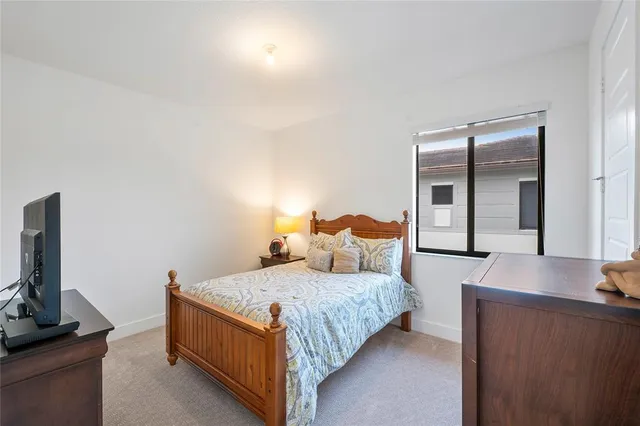 a bathroom with a double vanity sink mirror and toilet