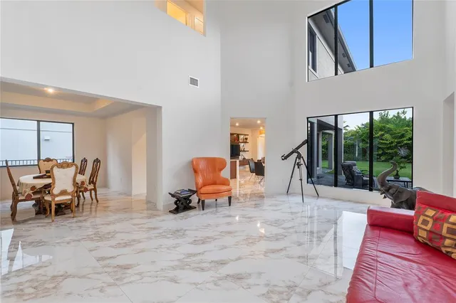 a large kitchen with stainless steel appliances granite countertop a sink stove and refrigerator