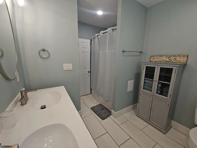 a bathroom with a sink and a shower