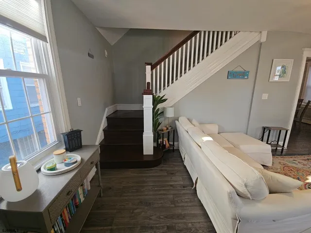a room with furniture and stairs
