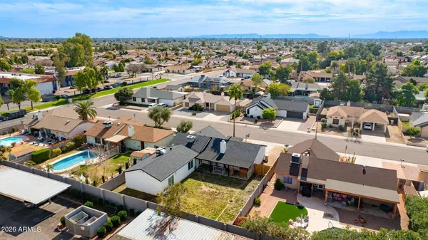 an aerial view of a house with a ocean view
