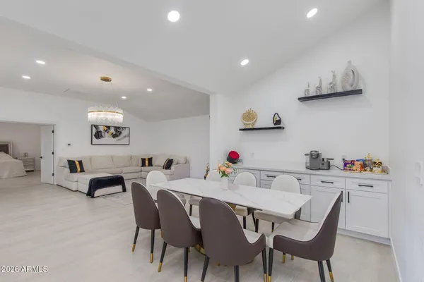 a dining room with furniture and window