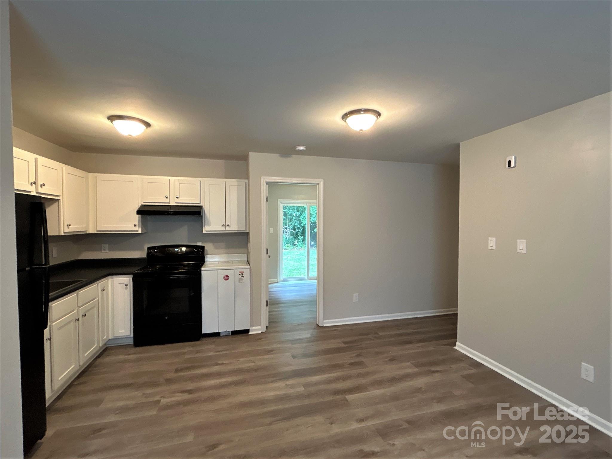 1850 Lowell Bethesda Road, Unit 6 Gastonia, NC 28056 - Photo 13 of 15 a kitchen with granite countertop a refrigerator and a stove top oven