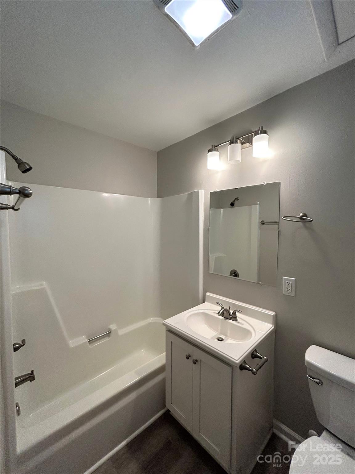 1850 Lowell Bethesda Road, Unit 6 Gastonia, NC 28056 - Photo 14 of 15 a bathroom with a sink and mirror with bathtub