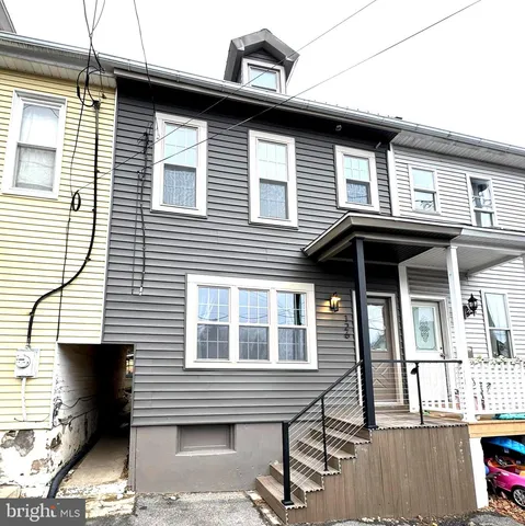 a front view of a house with a balcony