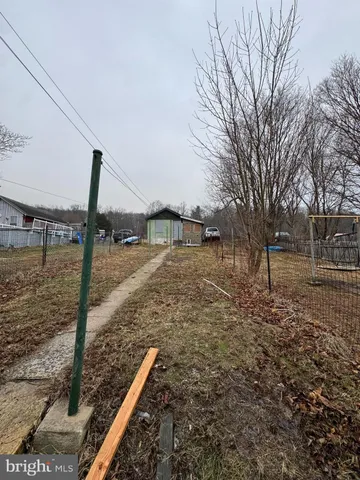 a view of backyard of a house