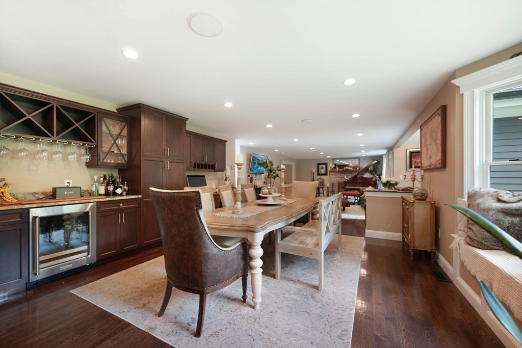 50 Elm Street Plympton, MA 02367 - Photo 14 of 40 a kitchen with a table chairs wooden floor and stainless steel appliances