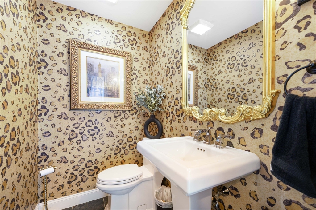 50 Elm Street Plympton, MA 02367 - Photo 18 of 40 a white toilet sitting next to a bathroom sink