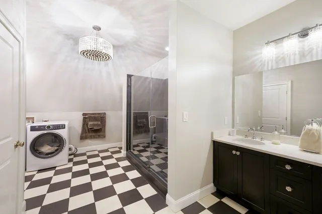 a bathroom with a sink a toilet and a mirror