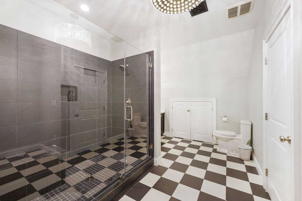 50 Elm Street Plympton, MA 02367 - Photo 22 of 40 a bathroom with a black and white checkered floor