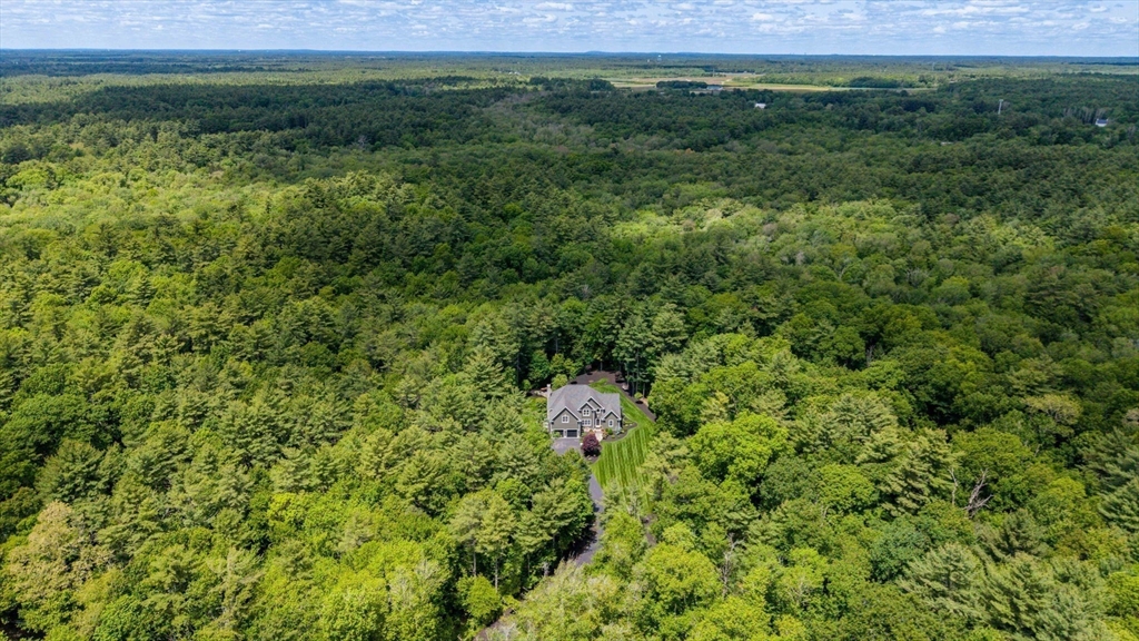 50 Elm Street Plympton, MA 02367 - Photo 4 of 40 a view of a green field with lots of bushes