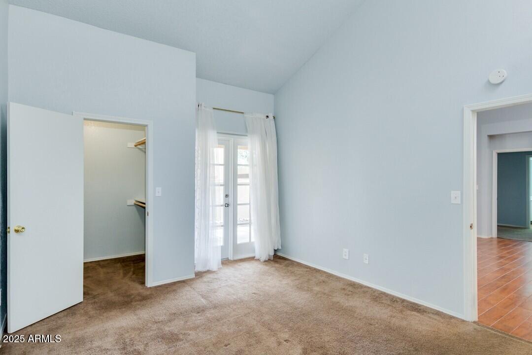 6900 East Gold Dust Avenue, Unit 149 Paradise Valley, AZ 85253 - Photo 22 of 34 an empty room with windows and closet