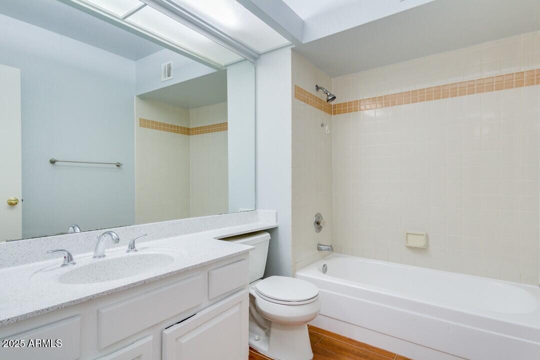 6900 East Gold Dust Avenue, Unit 149 Paradise Valley, AZ 85253 - Photo 25 of 34 a bathroom with a sink a toilet and a bathtub