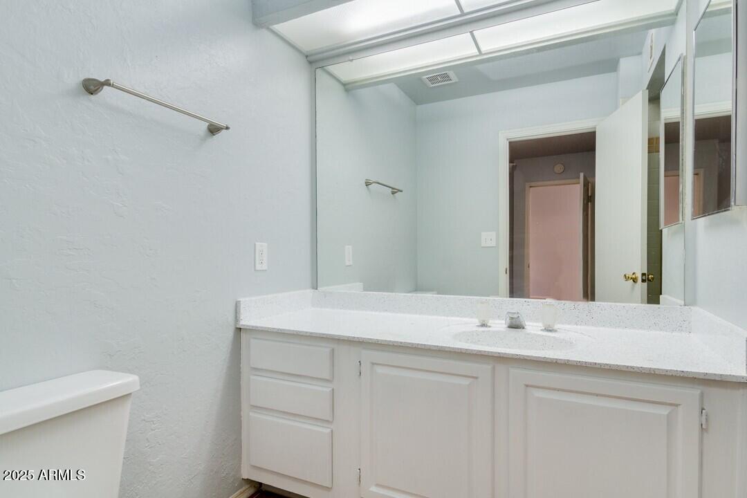6900 East Gold Dust Avenue, Unit 149 Paradise Valley, AZ 85253 - Photo 29 of 34 a bathroom with a sink and mirror