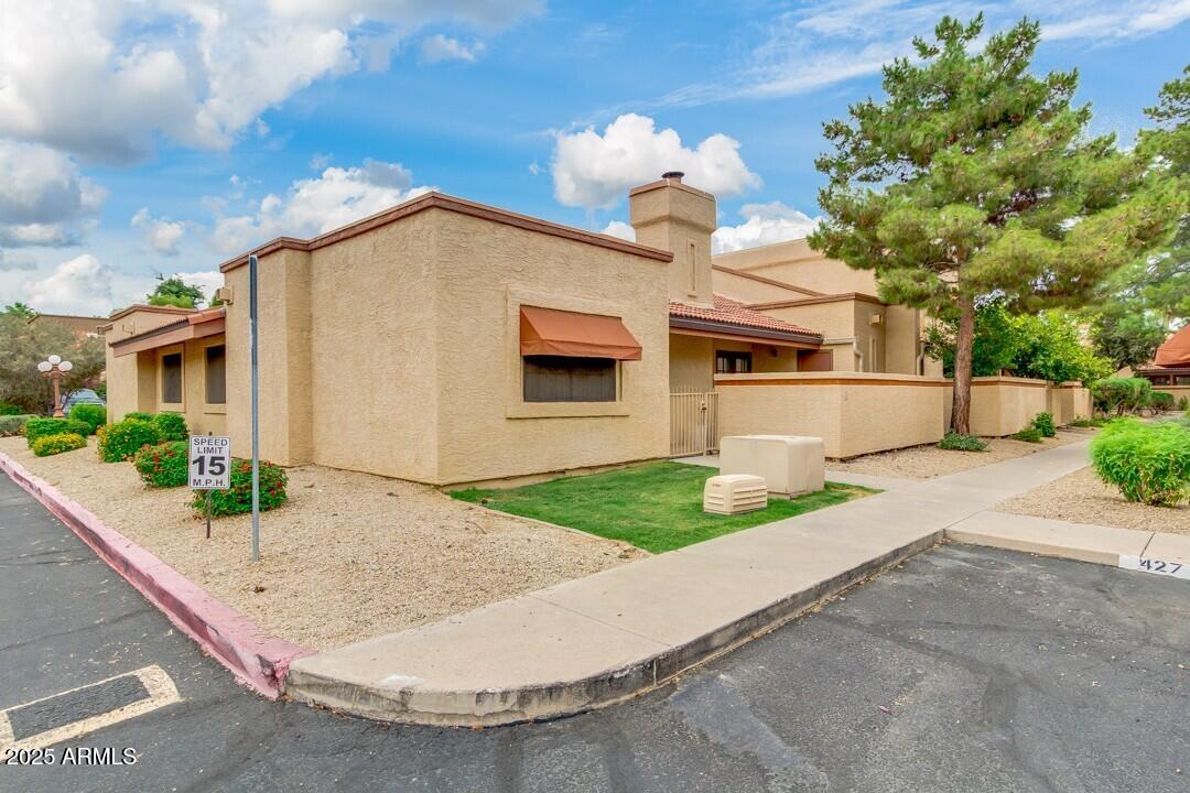 6900 East Gold Dust Avenue, Unit 149 Paradise Valley, AZ 85253 - Photo 3 of 34 a view of a house with a sink and yard